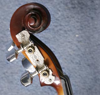 Violin scroll with guitar machine heads attached